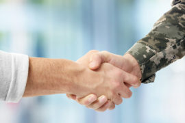 honoring veterans with shaking hands with veteran