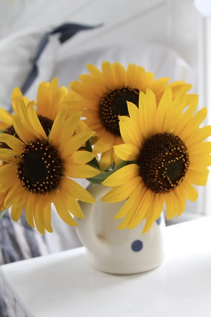 guest bedroom tips with sunflowers in a guest bedroom