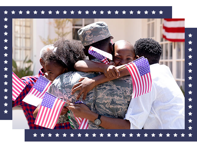 Photo of a service member's family hugging during a Veteran's Day celebration.