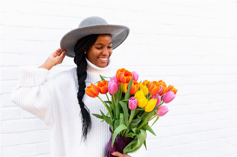 Picture of woman with tulips, flower of the year 2022
