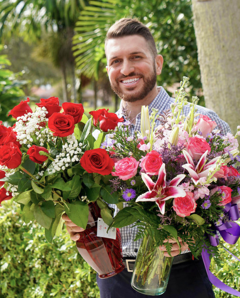 Relationship coach Eros Miranda with flowers