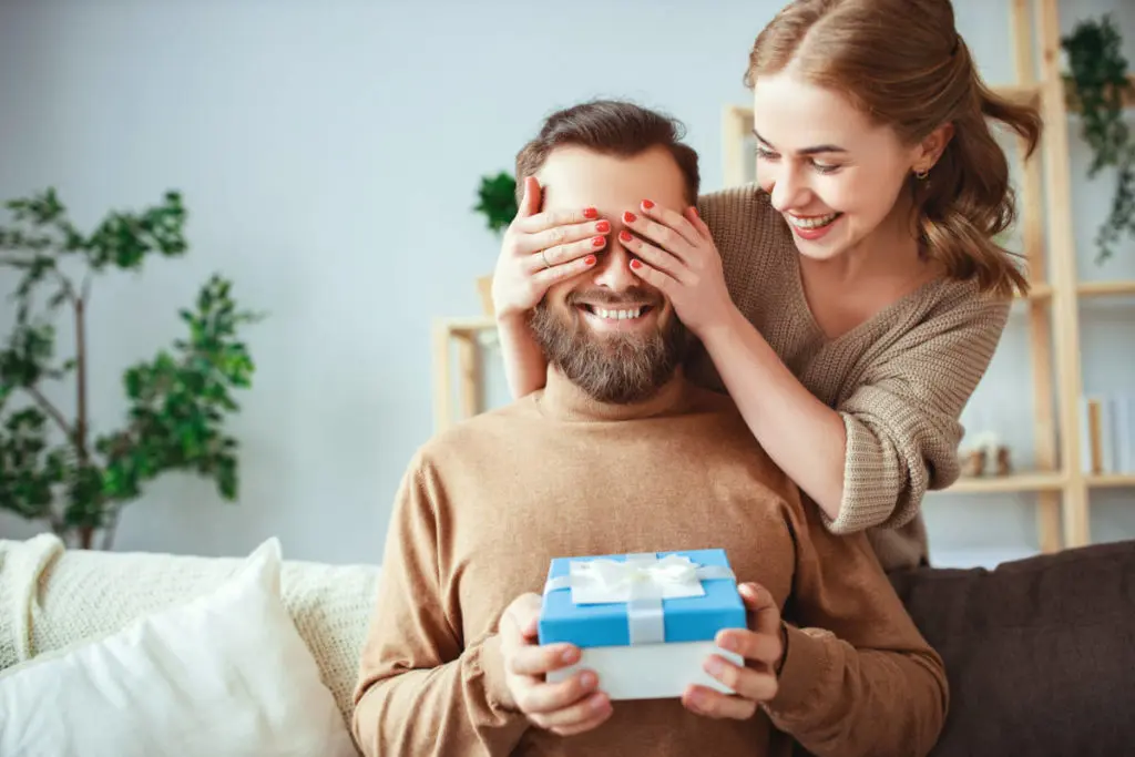 Photo of a married couple surprising each other with gifts thanks to the enhanced benefits of celebrations passport