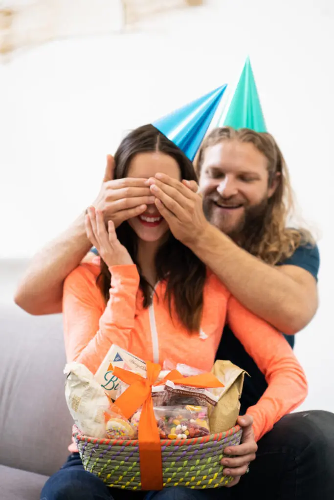 Photo of members of Celebrations Passport surprising each other with a gift basket.