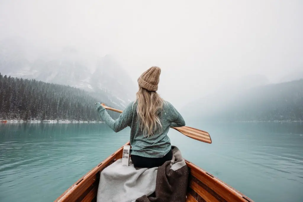 Picture of woman rowing a boat in winter