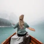 Picture of woman rowing a boat in winter