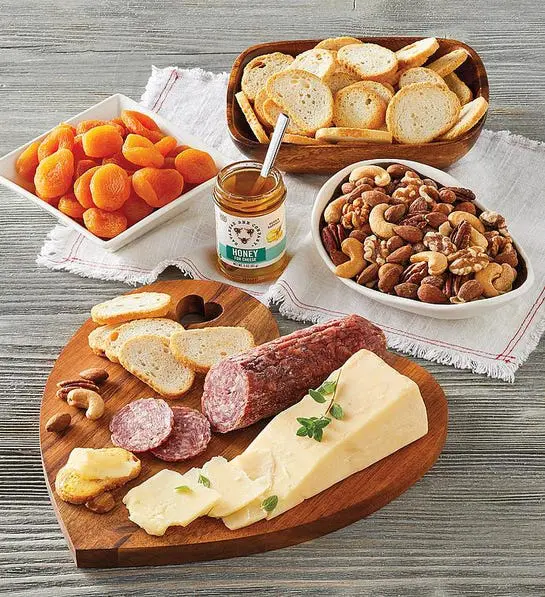 Photo of heart-shaped charcuterie and cheese tray Valentine's Day present