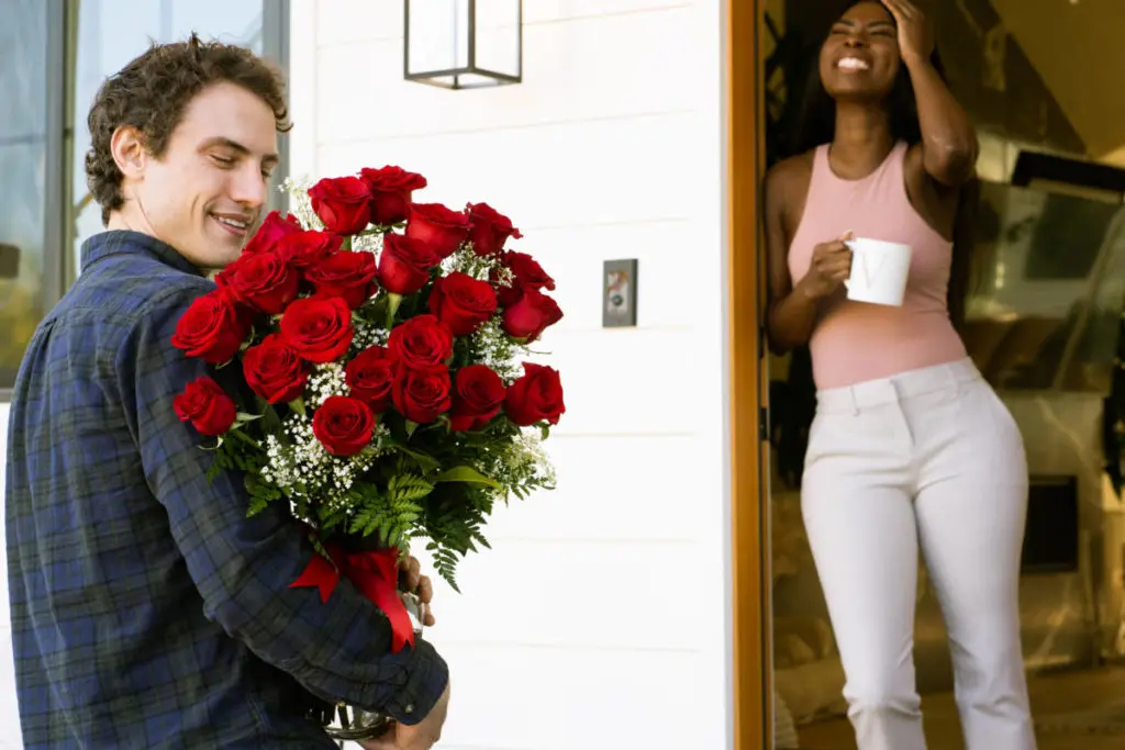 Picture of boy giving girl roses