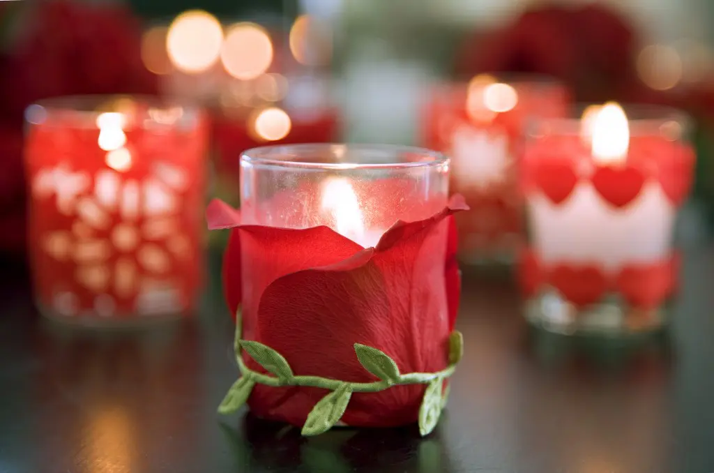 Make your Valentine's Day Flowers last with petal-covered votive candles.