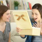 birthday gifts for sister: sister giving birthday gift