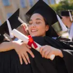 Celebrations Community: Father and daughter hugging at graduation