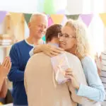 50-year-old woman receiving birthday gift