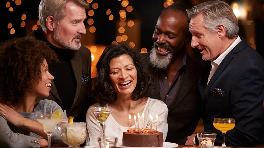middle-aged friends celebrating a birthday
