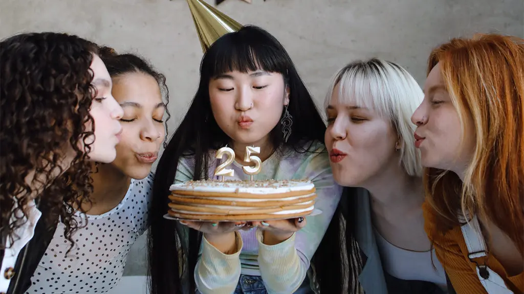 a photo of why every birthday is special: friends blowing out birthday candles