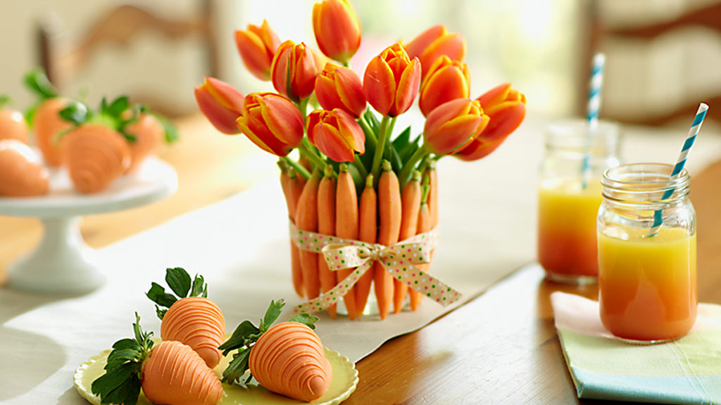 a photo of easter brunch ideas: carrots, tulips, and chocolate dipped strawberries