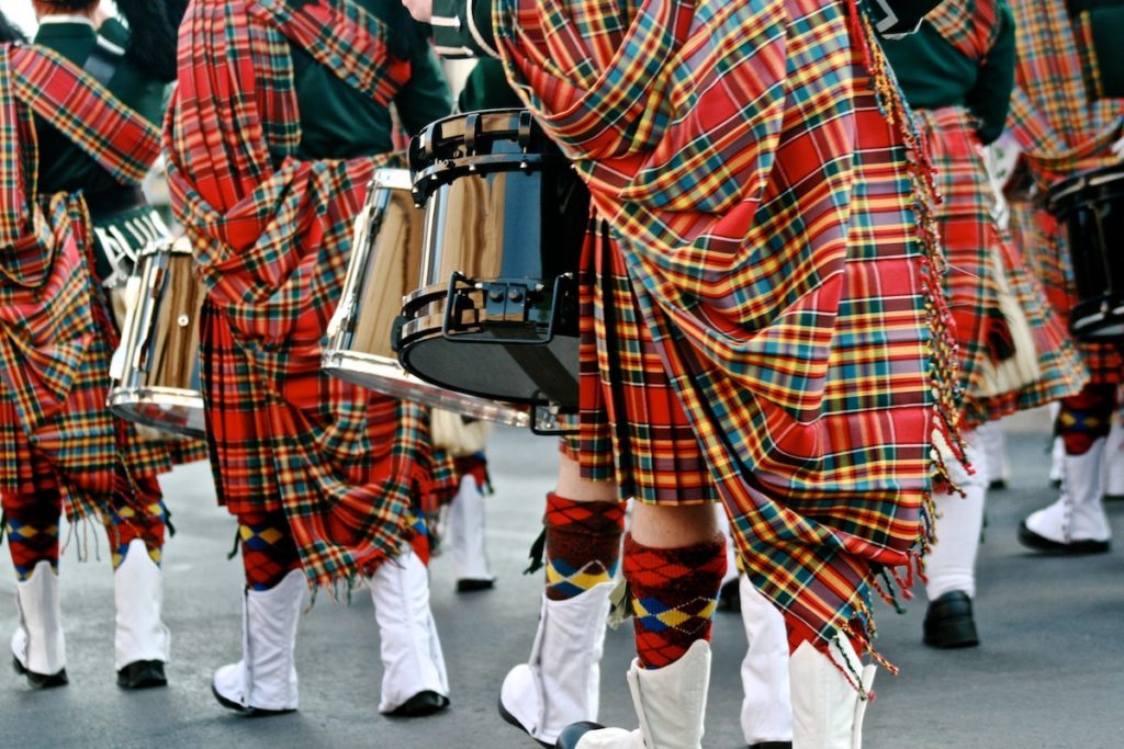 Picture or Saint Patrick's Day parade drummers in tartan kilts