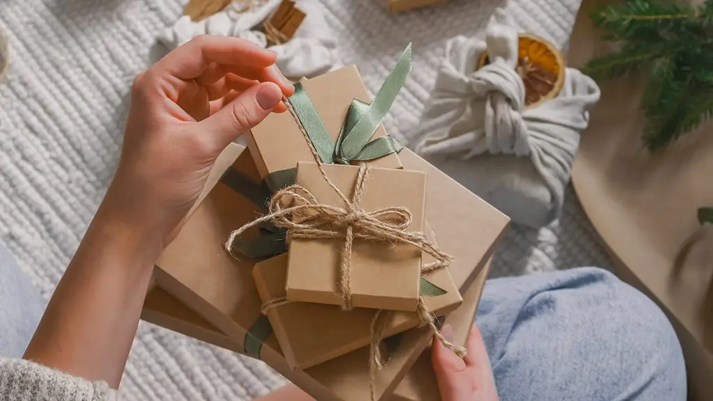 a photo of Person Who Is Hard to Shop For: holding a gift