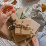 a photo of Person Who Is Hard to Shop For: holding a gift