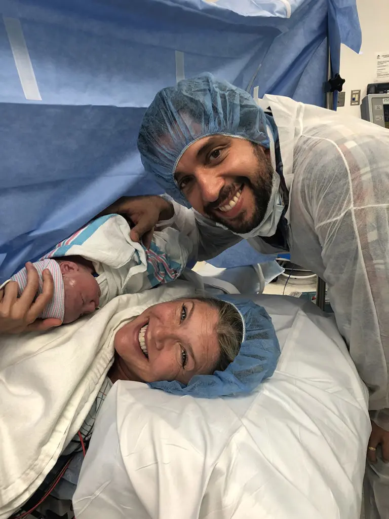 a photo of amanda kloots: amanda and nick with baby elvis