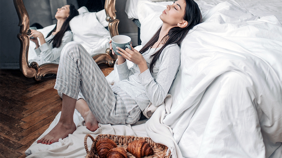 a photo of mother's day ideas: mom relaxing with coffee and croissants