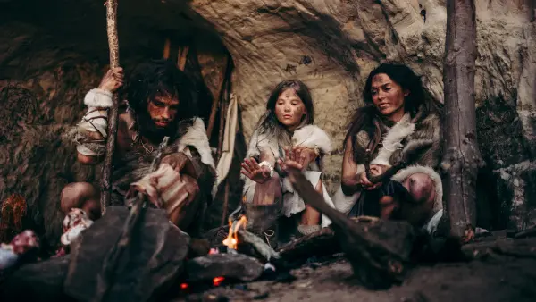 gift history with tribe of Prehistoric Primitive Hunter-Gatherers in a Cave at Night