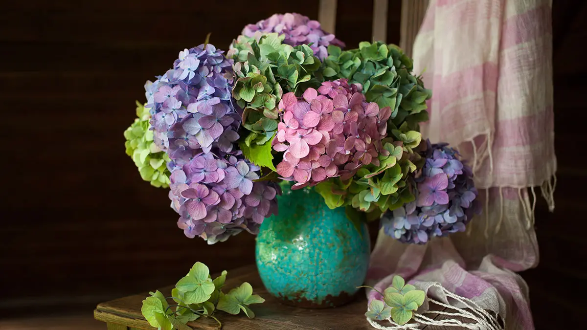 mother's day flower decorations with flowers in a pitcher