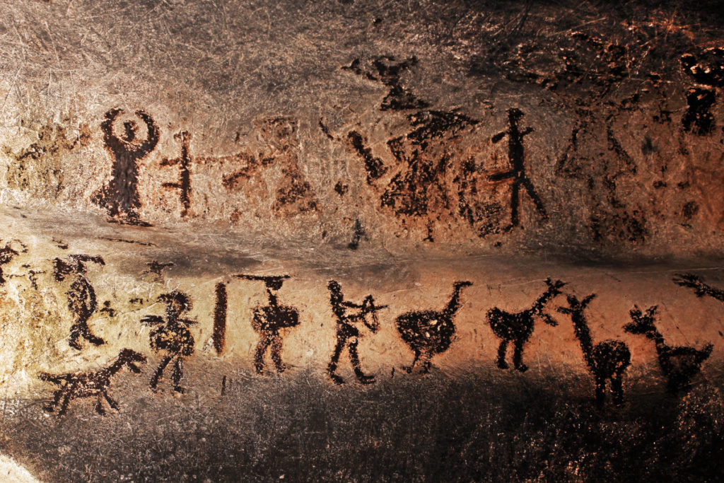 Photo of a cave painting illustrates the history of gift giving.