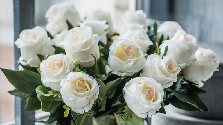 a photo of rose quotes with a bouquet of white roses