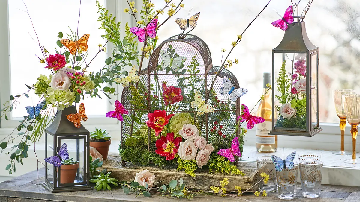 a photo of a butterflies and blooms vignette