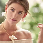 a photo of prom flowers: orchid earrings and necklace