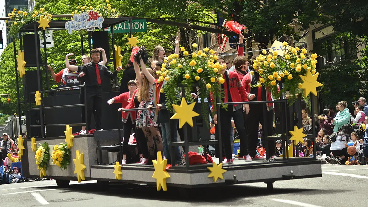 a photo of rose month with a float at the portland rose festival