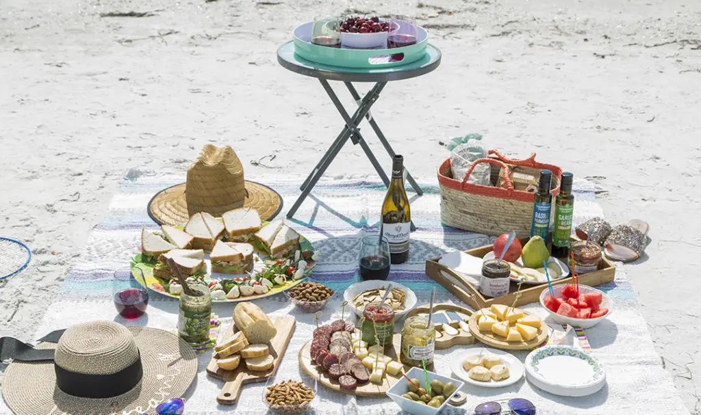 a photo of beach picnic with a beach picnic setup