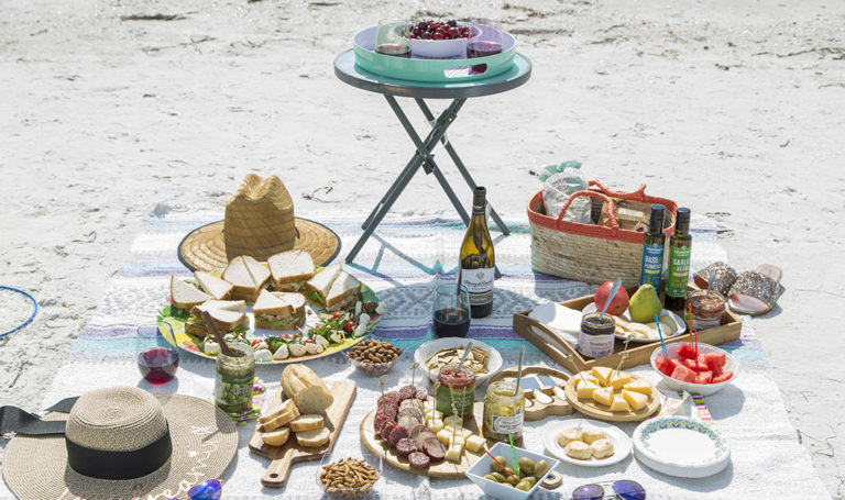 a photo of beach picnic with a beach picnic setup