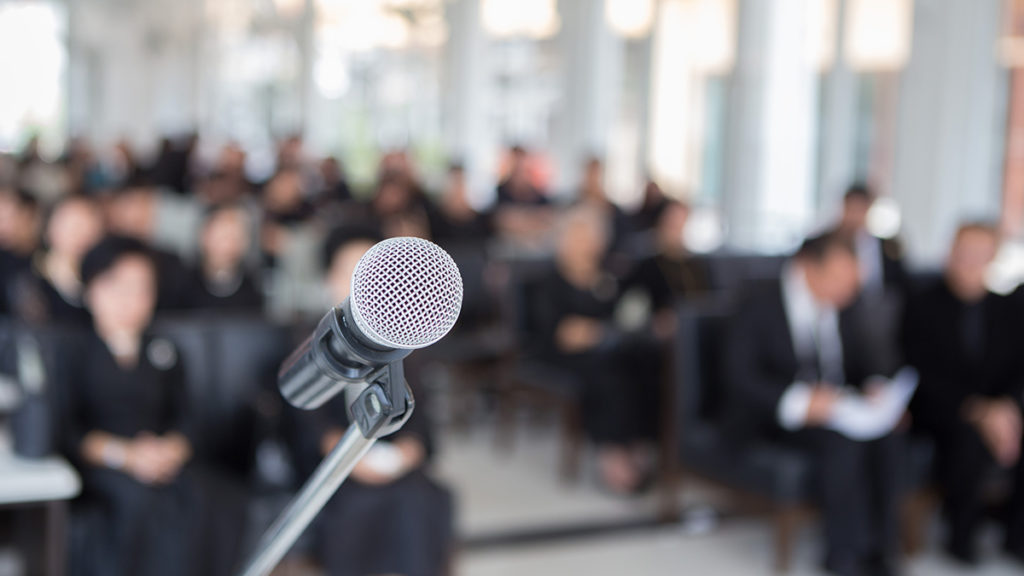 how to write a eulogy with a microphone on a funeral podium