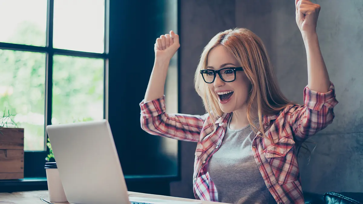 photo of alt bash with young woman rejoicing at her computer