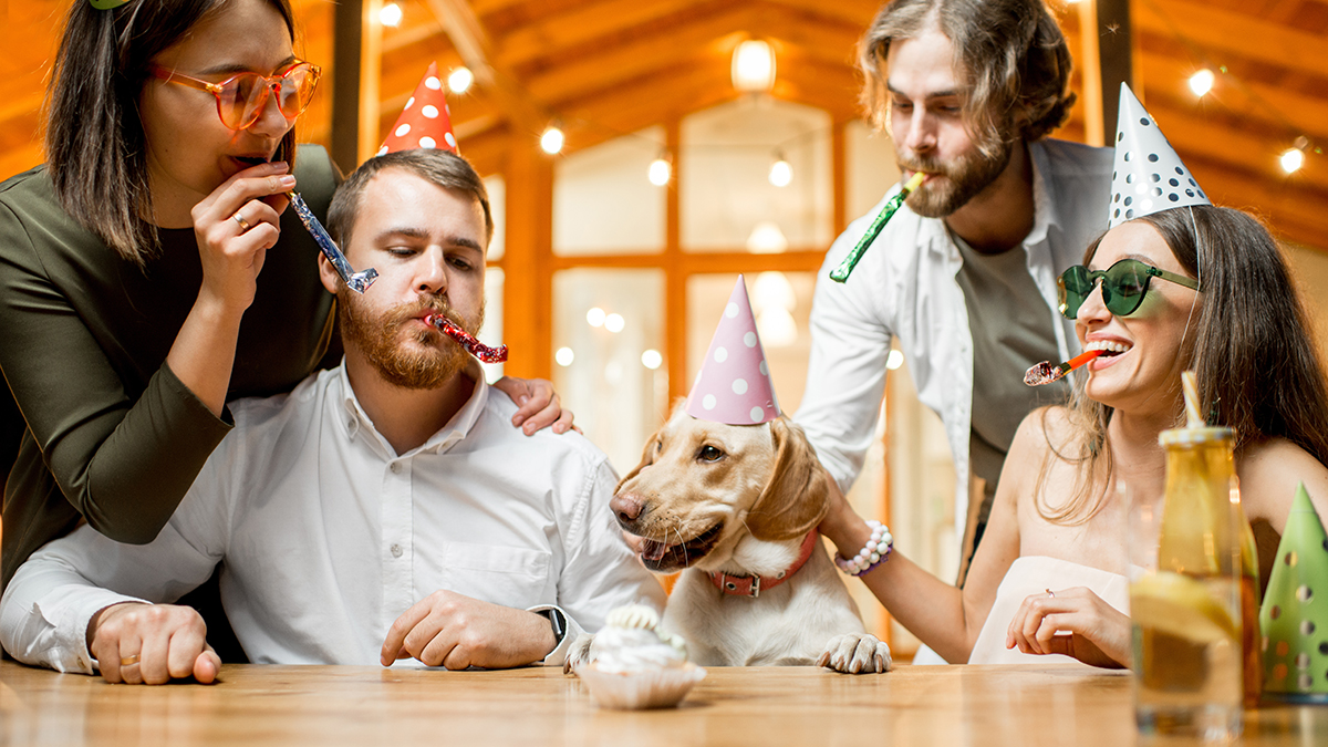 photo of alt bash with friends celebrating a dog's adoption