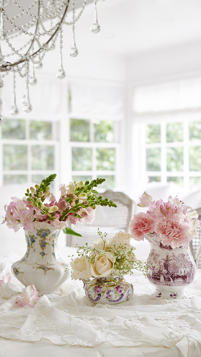 summer parties with vases of flowers on a table