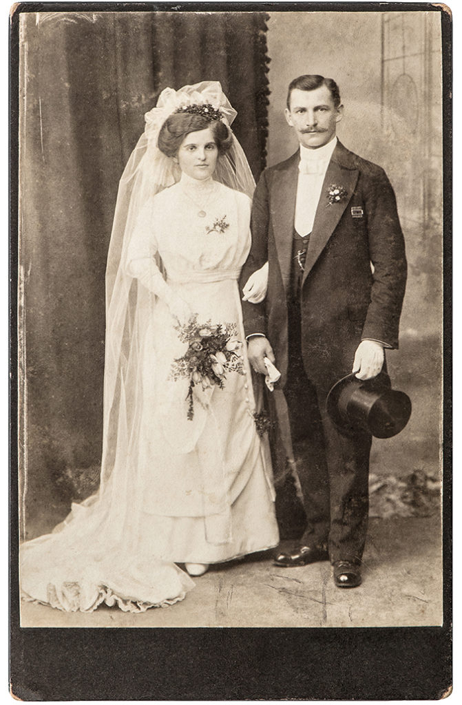 wedding bouquet with married couple from early 20th century