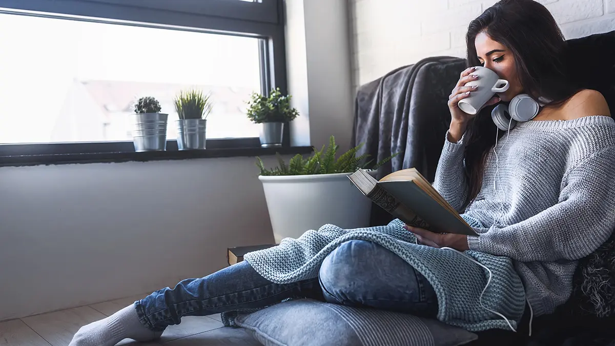 virgo gifts with women reading book and drinking coffee