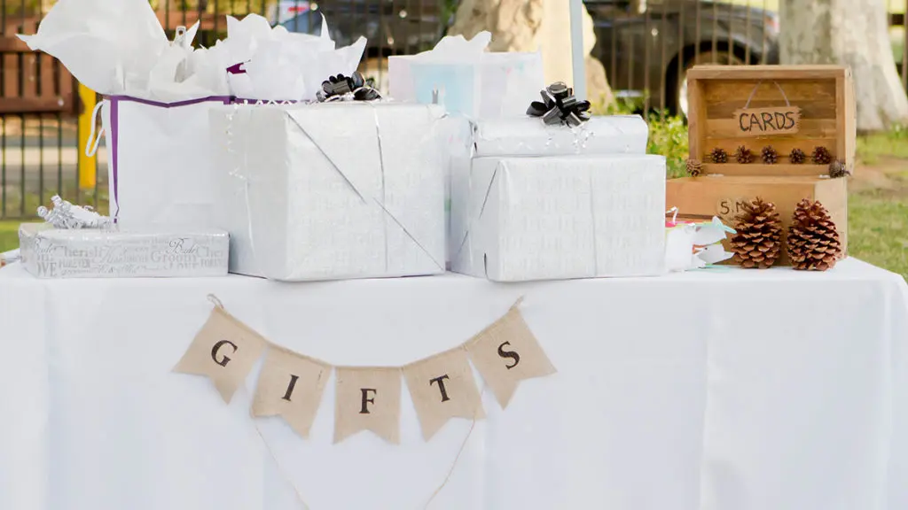 wedding gift etiquette with wedding gifts wrapped on a table