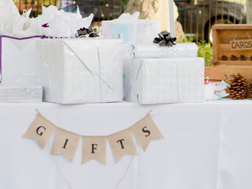 wedding gift etiquette with wedding gifts wrapped on a table
