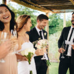 wedding toast with Best man giving speech to newlywed couple at wedding reception