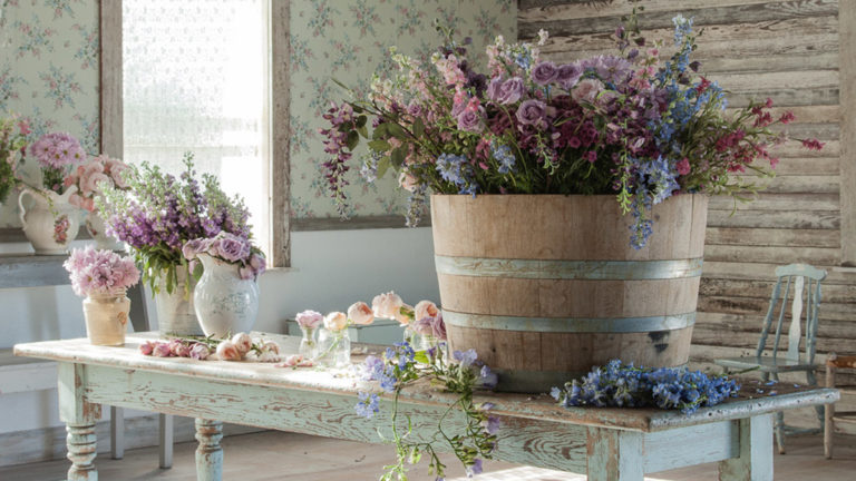 Bringing the Outside In: How to Decorate for Fall With Shabby Chic® Founder Rachel Ashwell decorating for fall with fall flowers on a table