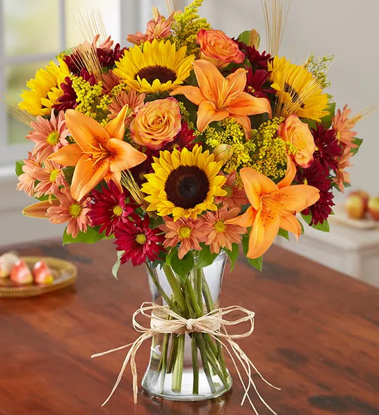 Sweetest day gifts with a fall flower arrangement.