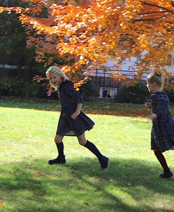 loving fall with girls running in a fall field