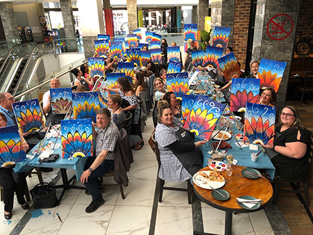 Photo of a Paint Nite flower painting event