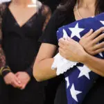funeral etiquette with woman holding american flag