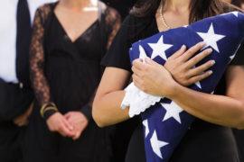 funeral etiquette with woman holding american flag