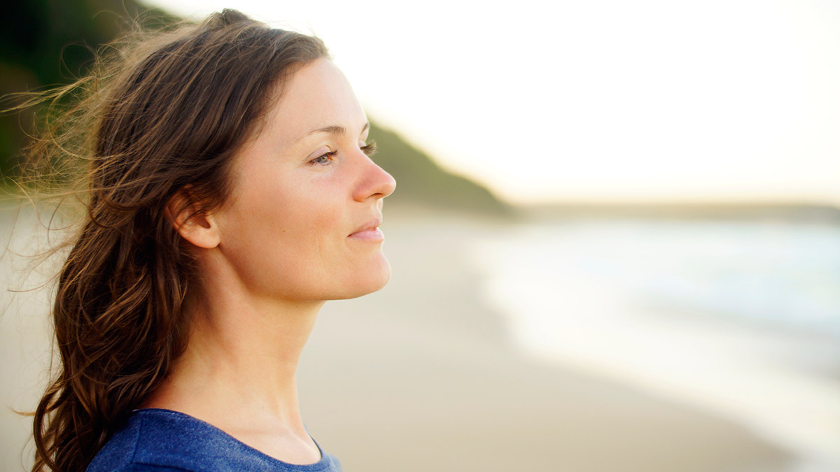 birthday gifts for libra with woman staring out at ocean