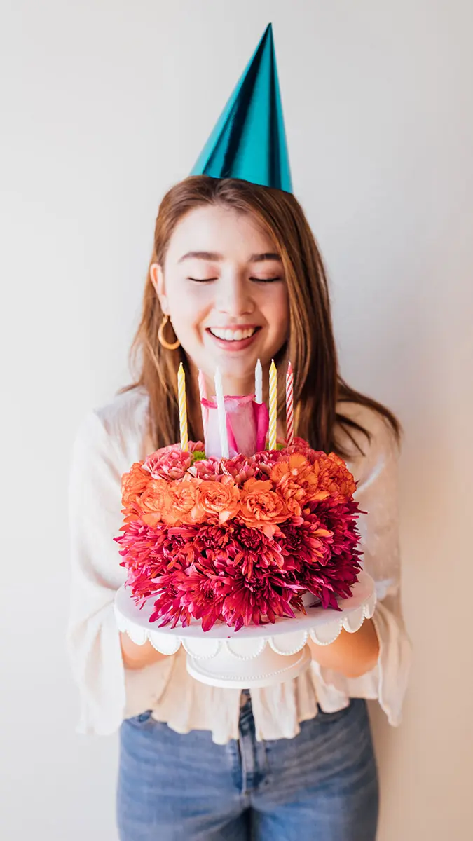 birthday quotes with girl holding flower cake