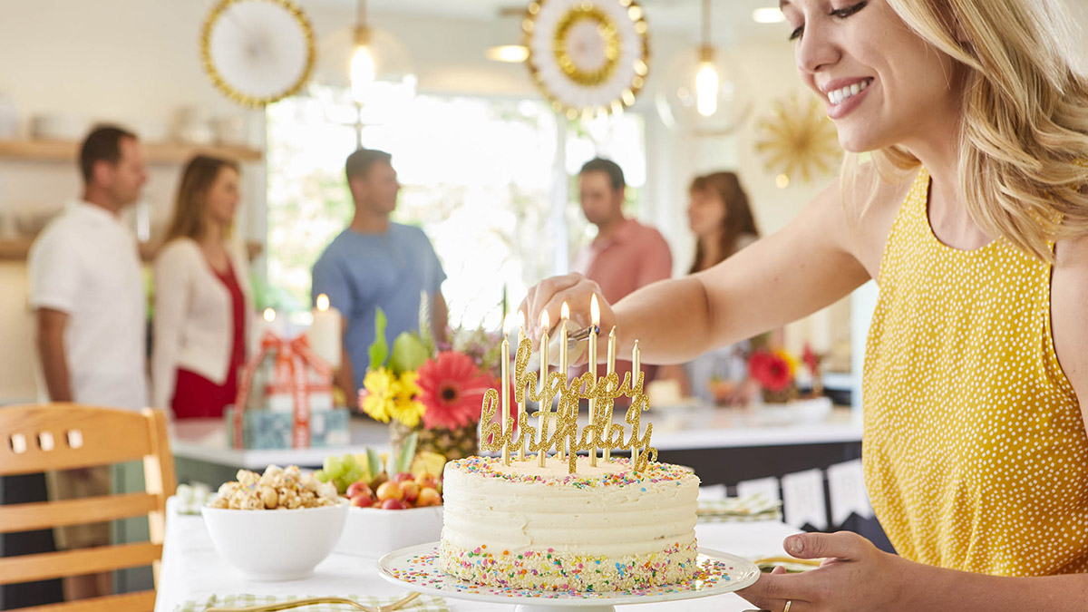 birthday quotes with lighting candles on birthday cake